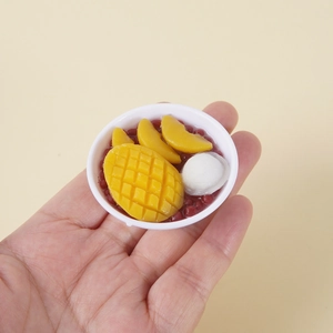 Miniature mango red bean dessert bowl model held by hand to show 5cm small size