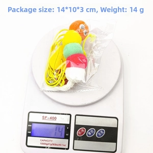 Hanging caterpillar cat toy on electronic scale showing 14g weight and 14x10x3cm size