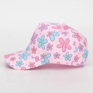 Close-up of pink kids baseball cap featuring colorful floral patterns and curved brim