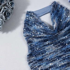 Detail of blue sequin fabric with plush texture and silver sparkles for top