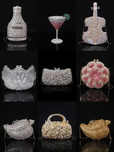 Macro shot of champagne bottle clutch with Sweet & Subtle engraving and crystal chain