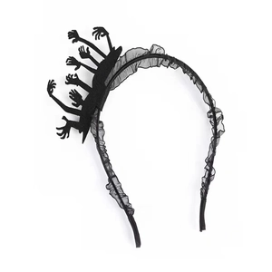 Macro shot of Halloween headband featuring gothic black small hands and tulle frill details