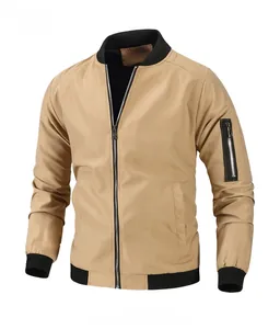 Detail of khaki bomber jacket featuring ribbed collar and functional arm zipper pocket