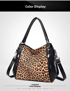 Detail view of large leopard print tote bag with black faux leather trim and strap