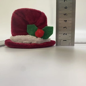 Close-up of a 5cm mini Christmas velvet hat with white fur trim and size ruler reference