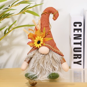 Detailed close-up of Thanksgiving gnome featuring maple leaves and sunflower accents
