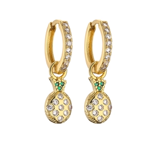 Detailed view of gold pineapple earrings with green and white cubic zirconia crystals