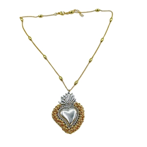 Sacred Heart pendant necklace with 18k gold beads and silver flame detail on chain