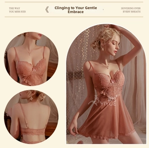 Detailed view of floral lace cups and adjustable straps on a coral mesh chemise