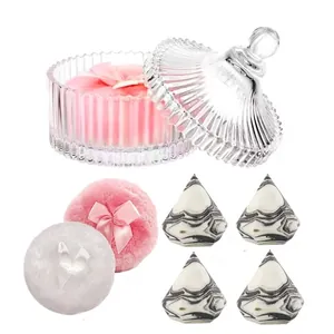 Plush makeup powder puff set with bow and marble beauty blenders in a glass storage jar