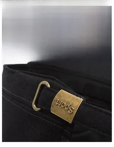 Detail of adjustable brass buckle with Sport engraving on black cotton flat top hat