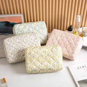 Quilted floral cosmetic bag set in four colors for travel and makeup storage