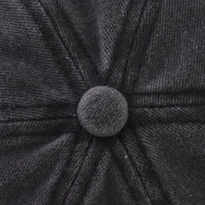 Macro shot of charcoal grey washed cotton crown with reinforced stitching on baseball cap