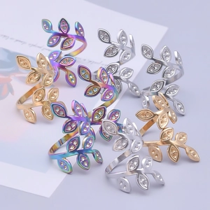 Minimalist leaf rings in gold, silver, and rainbow steel with adjustable open bands