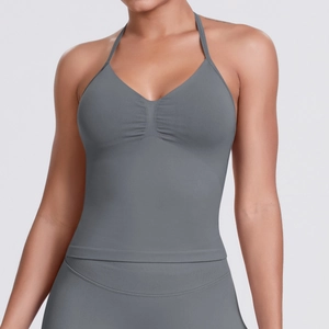 Close-up of seamless smoke gray yoga top with halter neck and ribbed texture