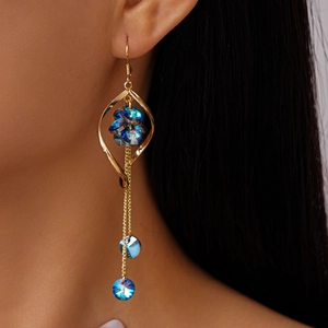 Golden twisted fringe earrings with navy blue faceted crystals and long metal tassels
