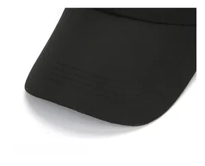 Detail view of reinforced black baseball cap brim with four rows of parallel stitching
