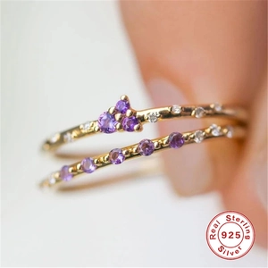 Detailed close-up of S925 sterling silver gold plated ring with purple amethysts