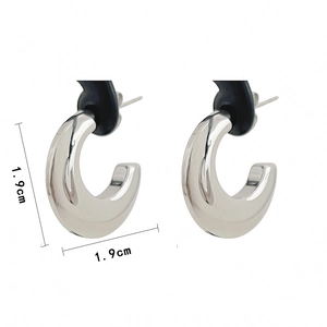 Detailed view of silver-polished C-shaped hoop earrings showing 1.9cm dimensions