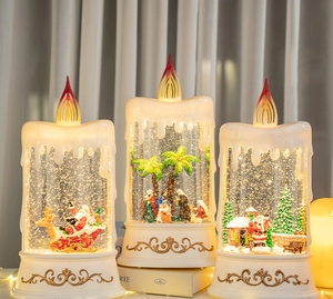 Close-up of LED Christmas water globe candle with vintage gold base and nativity scene