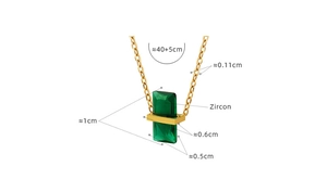 Detailed view of gold zircon pendant necklace with green stones and measurement specs