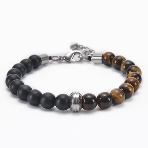 Detail of 8mm matte black and tiger eye stone beads with stainless steel lobster clasp