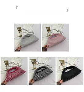 Detail view of five luxury rhinestone evening clutch bags with chain straps in various colors