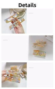 Detail of colorful gradient acetate hair claw clip with elegant marble texture