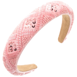 Detail of pink beaded headband with geometric embroidery and soft suede lining