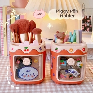 Close-up of pink and orange multi-functional desk organizers with cute stickers