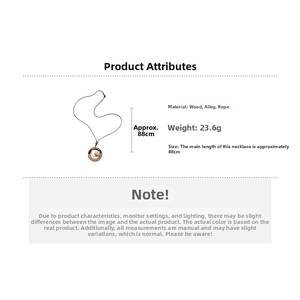 Detail view of ethnic long necklace with wooden ring, bird pendant, 88cm cord length