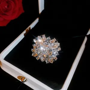 Sparkling diamond flower ring for women in a white velvet-lined jewelry display box