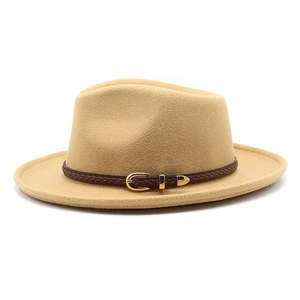 Detailed view of camel wool fedora hat featuring a brown leather band and gold buckle