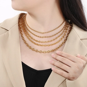 Multi-layer gold stainless steel chain necklace set worn by model for trendy look