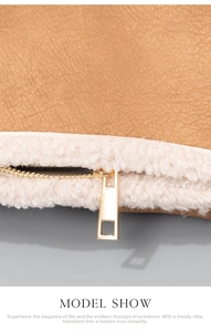 Detail of brown faux leather and white sherpa lining with a sleek gold zipper closure