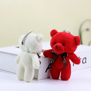 Detail of red and white teddy bear charms with Love ribbons and beaded chains