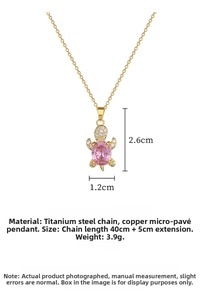 Detail of pink turtle pendant necklace in titanium steel with zircon crystal setting