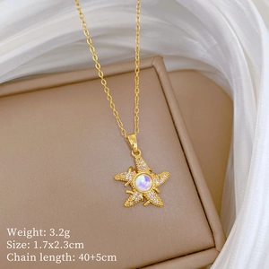 Detailed view of gold starfish pendant with colorful gems and size specifications