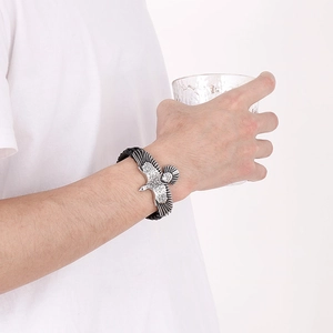Men's punk leather bracelet featuring a silver eagle pendant on a black braided strap