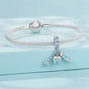 925 silver charm bracelet with family engraving and miniature toothbrush pendants
