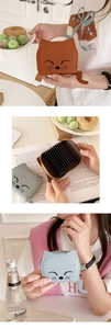 Detail of cute cat shaped card holder featuring leather cat ear design and interior card slots
