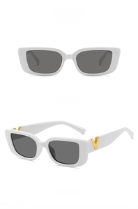 Detailed side view of white frame sunglasses featuring a golden V logo on the temple