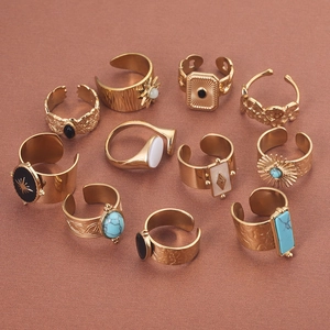 Set of 11 bohemian gold rings with turquoise and black onyx in a vintage open style