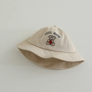 Beige kids cotton bucket hat featuring Feel Good bear embroidery and soft textured fabric