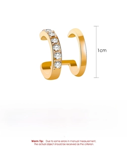 Macro detail of gold-plated double-layer ear cuff with inlaid white cubic zirconia stones