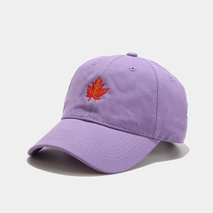 Lavender purple cotton baseball cap with red maple leaf embroidery on a light background