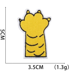 Close-up showing 5cm x 3.5cm dimensions of an embroidered tiger paw patch for clothing