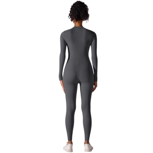 Deep grey long sleeve one-piece athletic jumpsuit for yoga and fitness with slim back lines