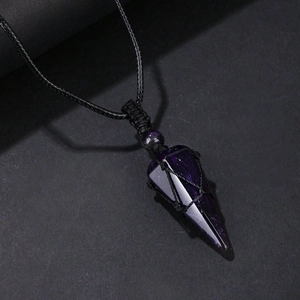 Macro shot of dark purple hexagonal crystal pendant with black hand-woven rope mesh wrap
