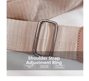 Detailed view of the champagne gold nylon strap and silver metal adjustment buckle
